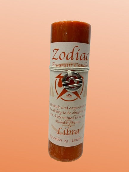 Zodiac themed candle with Libra symbol on a peach background