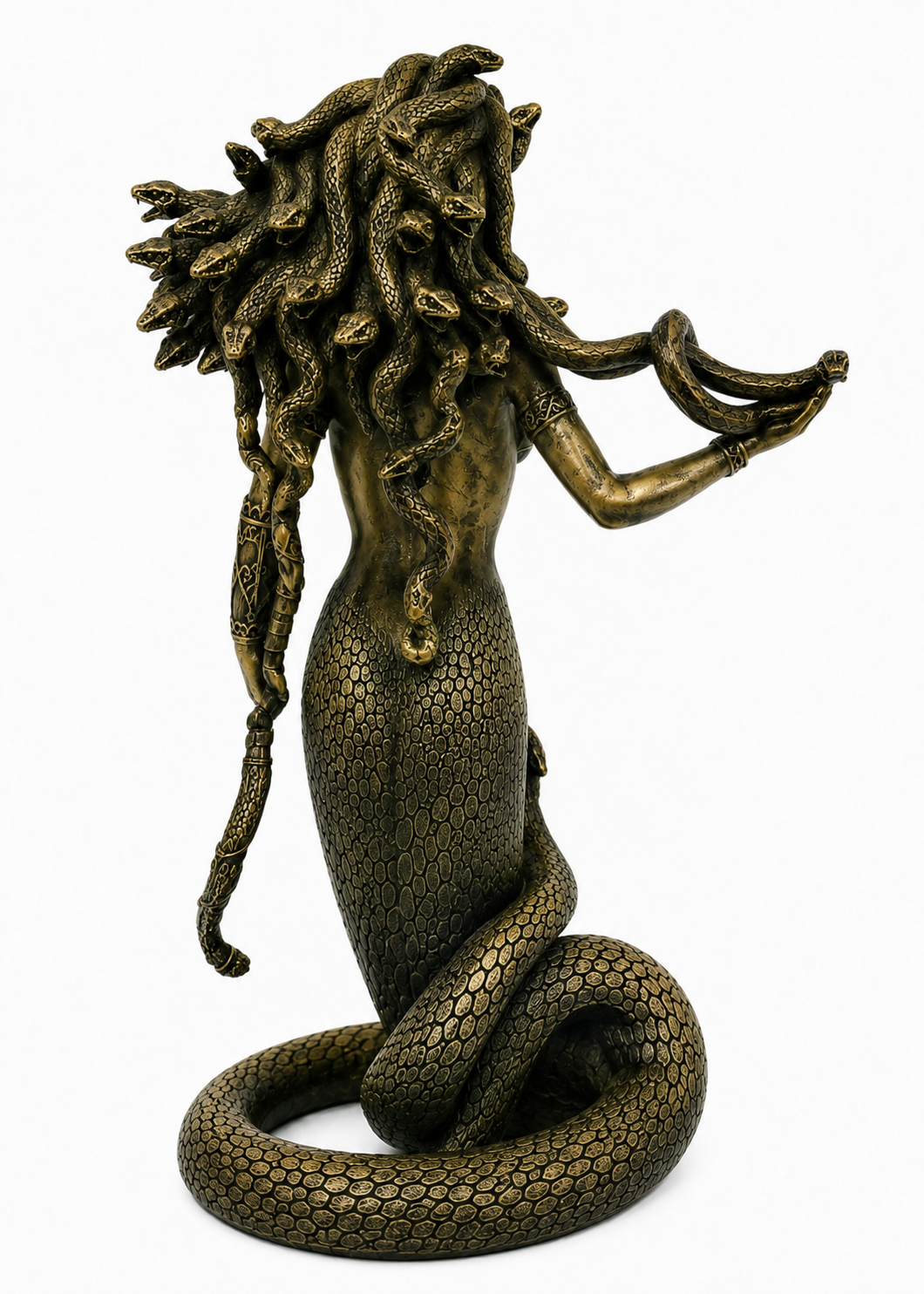 Bronze statue of Medusa with flowing hair on a white background