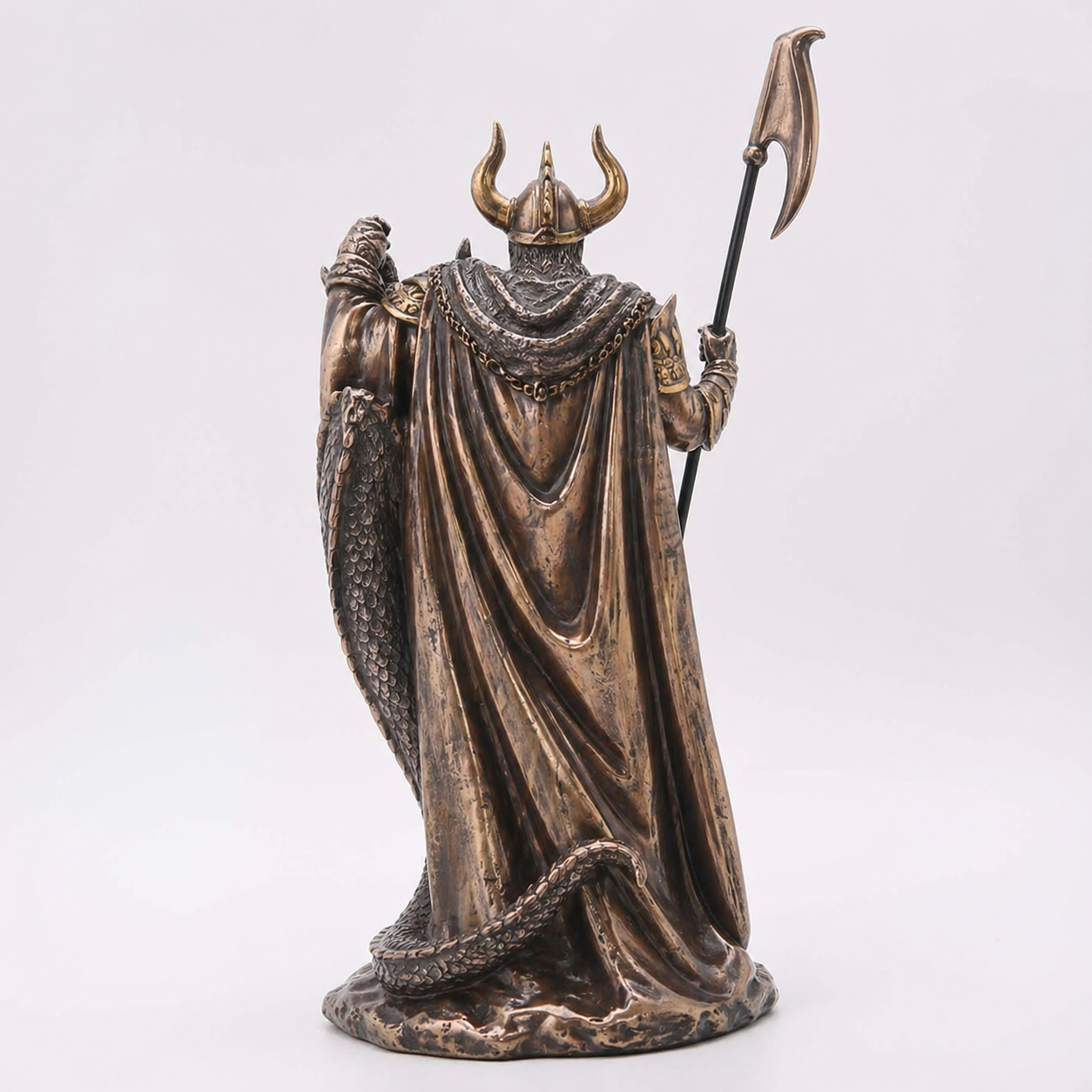 Bronze statue of Loki with a helmet and spear on a white background