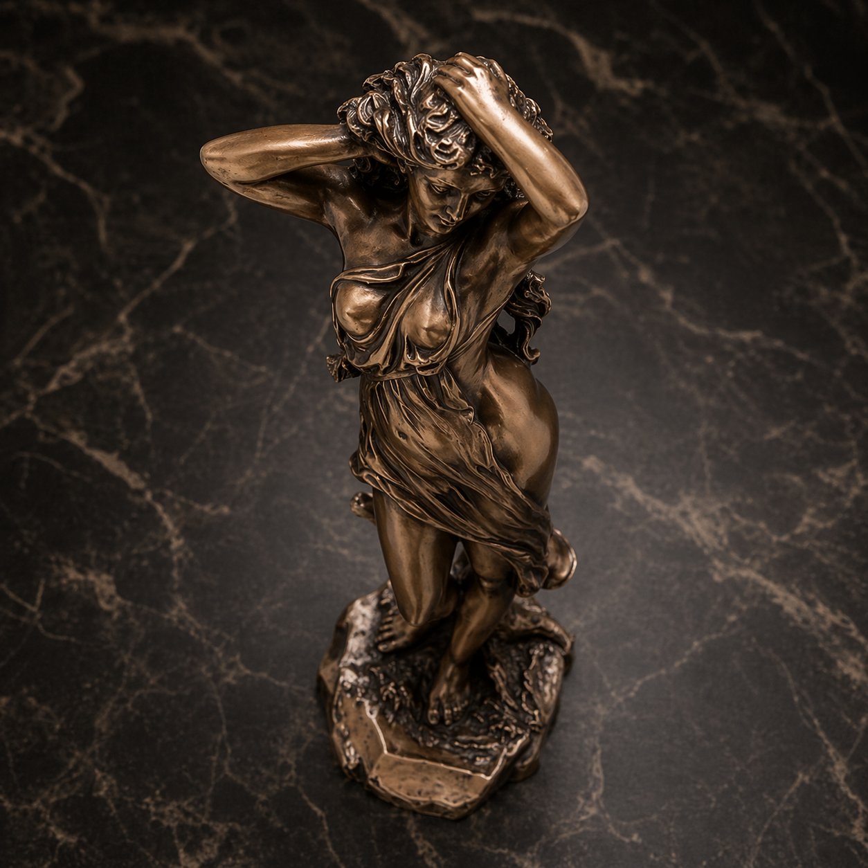 Bronze statue of Aphrodite on a marble surface