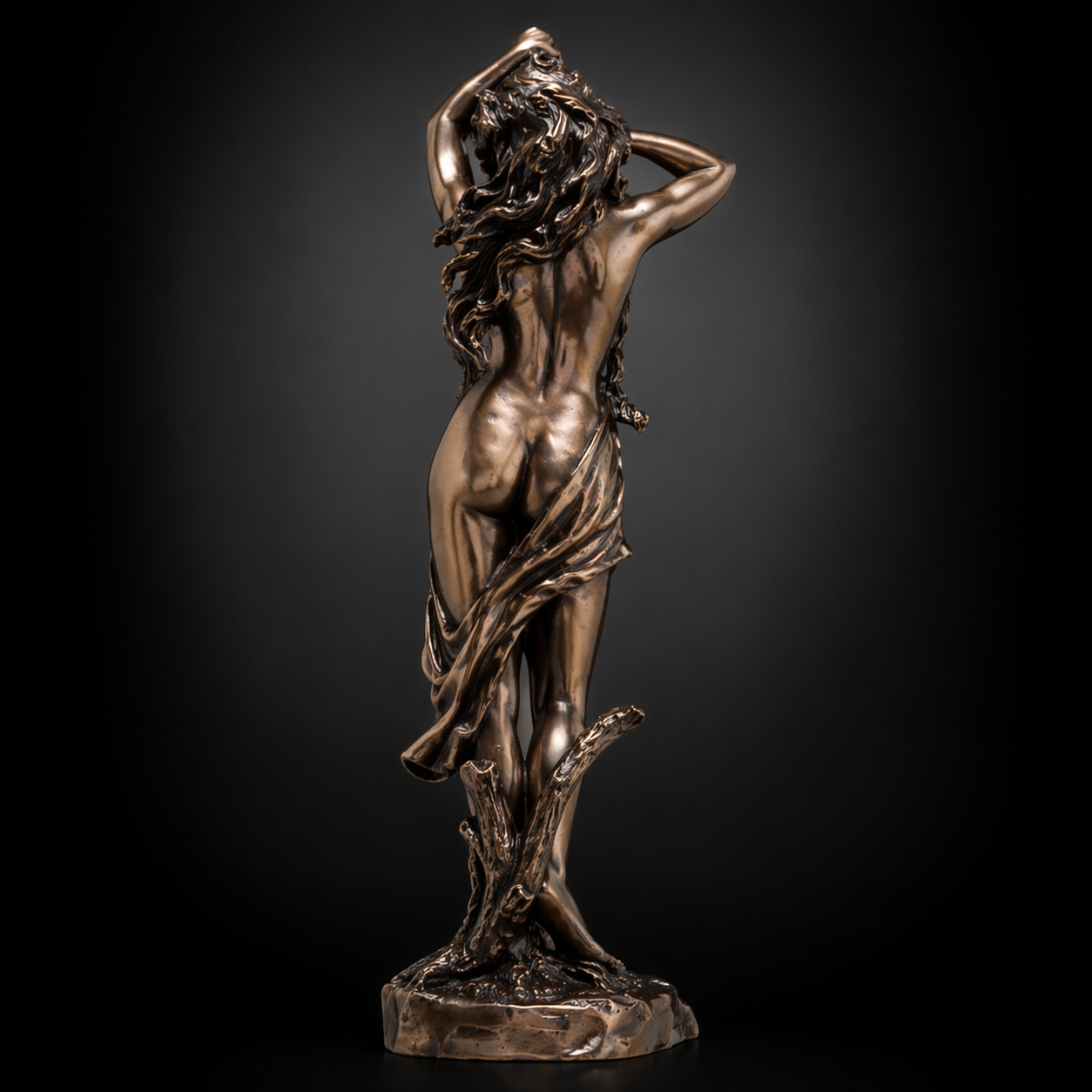 Bronze statue of Aphrodite against a dark background