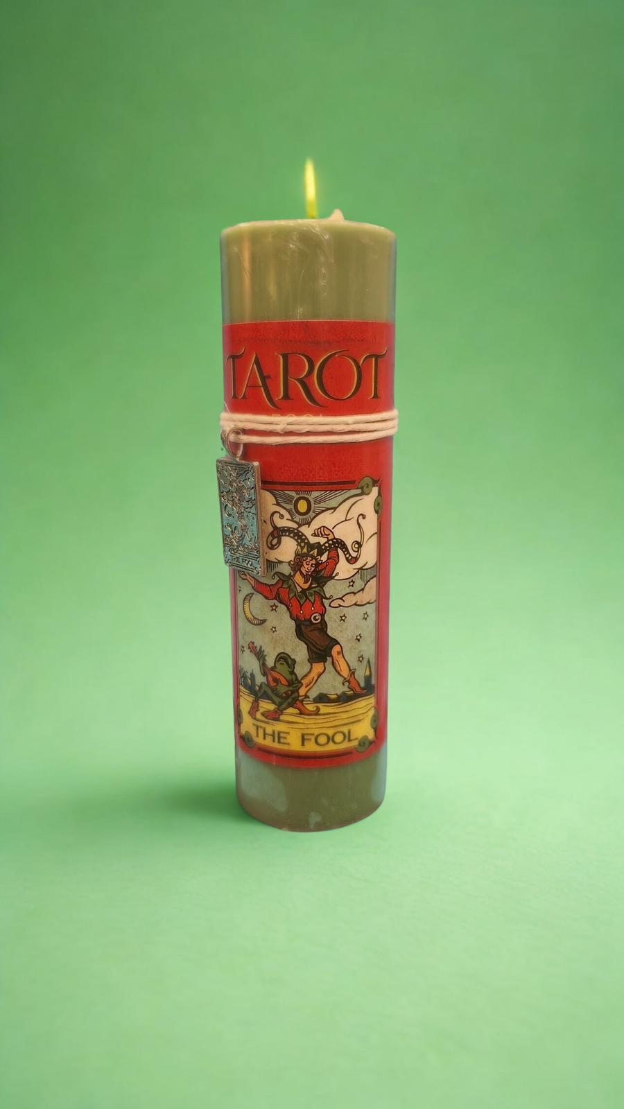 Candle with Tarot design on a green background