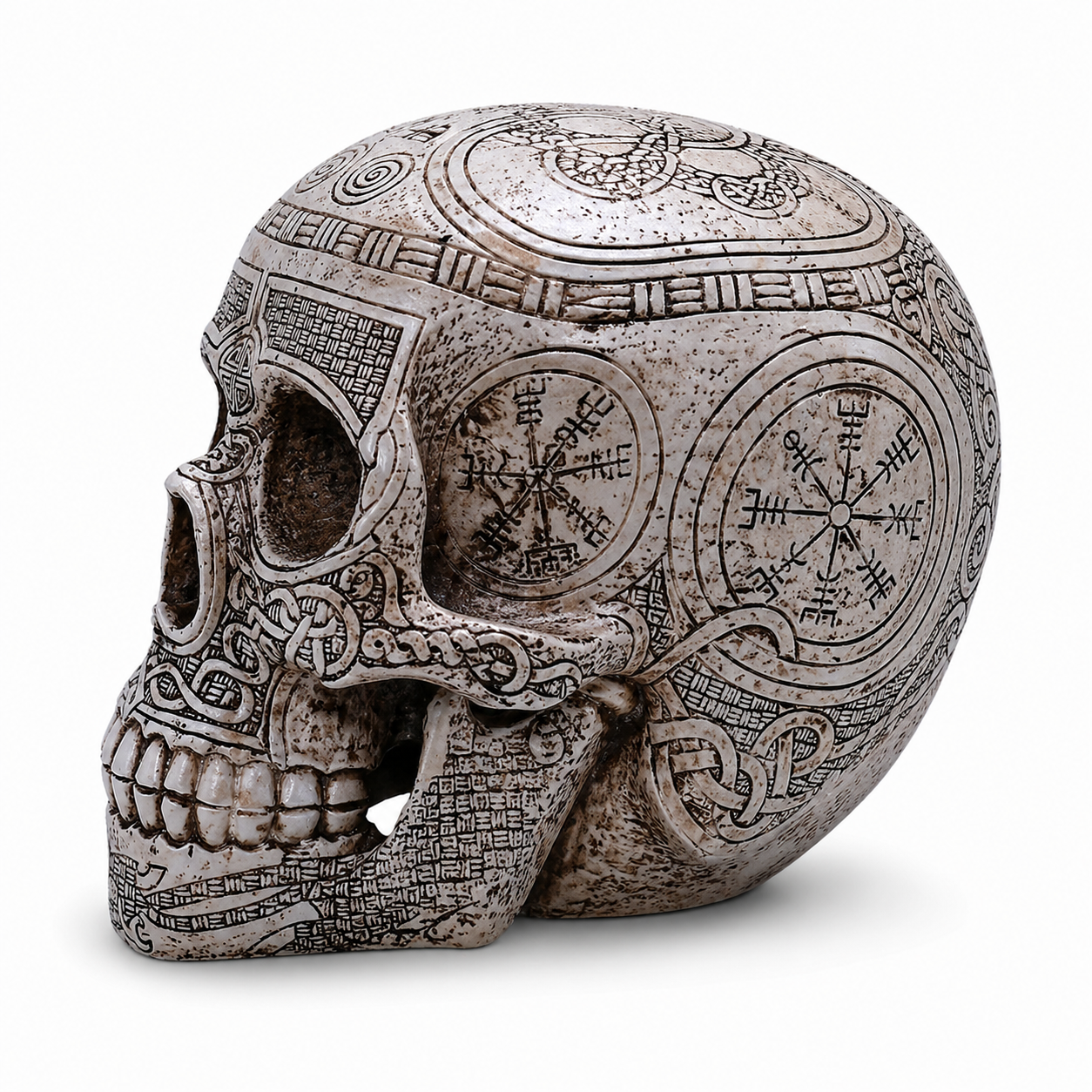 Decorative Viking skull with intricate designs and symbols on a white background