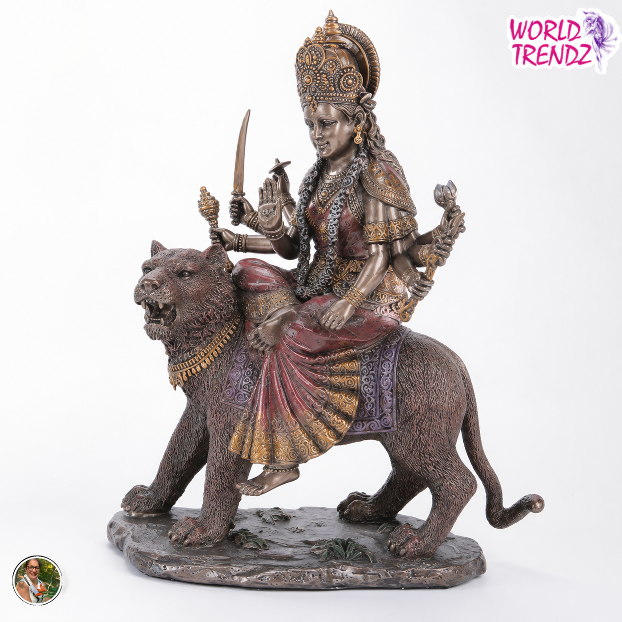 A detailed bronze-finished statue of Goddess Durga riding a lion, set against a plain white background with a 'WORLD TRENDZ' logo in the top right corner.