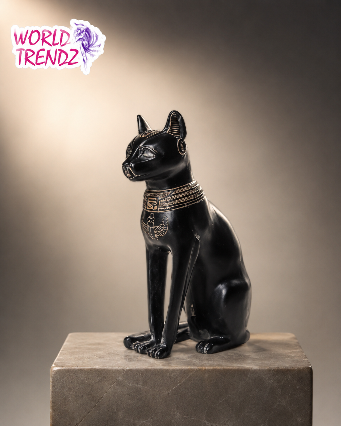 A black Egyptian cat statue Bastet with gold detailing, sitting on a gray stone pedestal against a warm gradient background. A 'WORLD TRENCHZ' logo is visible in the top-left corner.