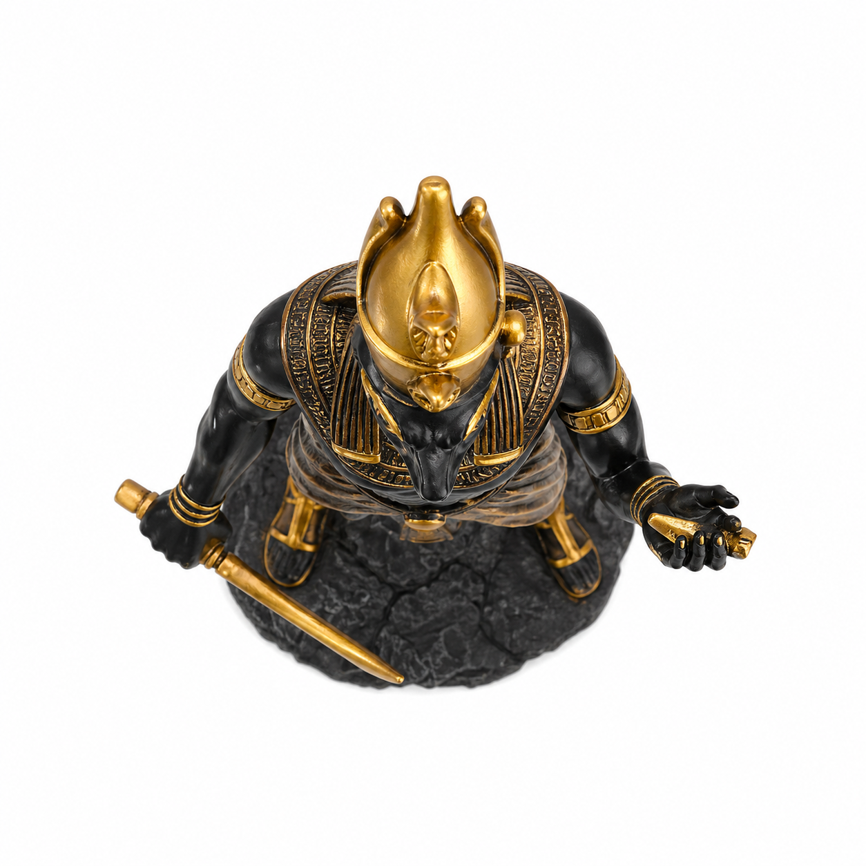 Statue of Horus deity with gold and black details on a white background
