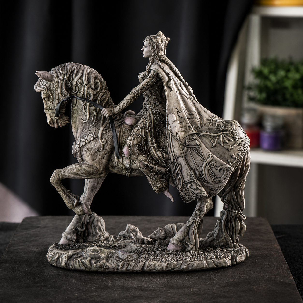 Freshwater Goddess Rhiannon on a horse with intricate details, set against a blurred indoor background.