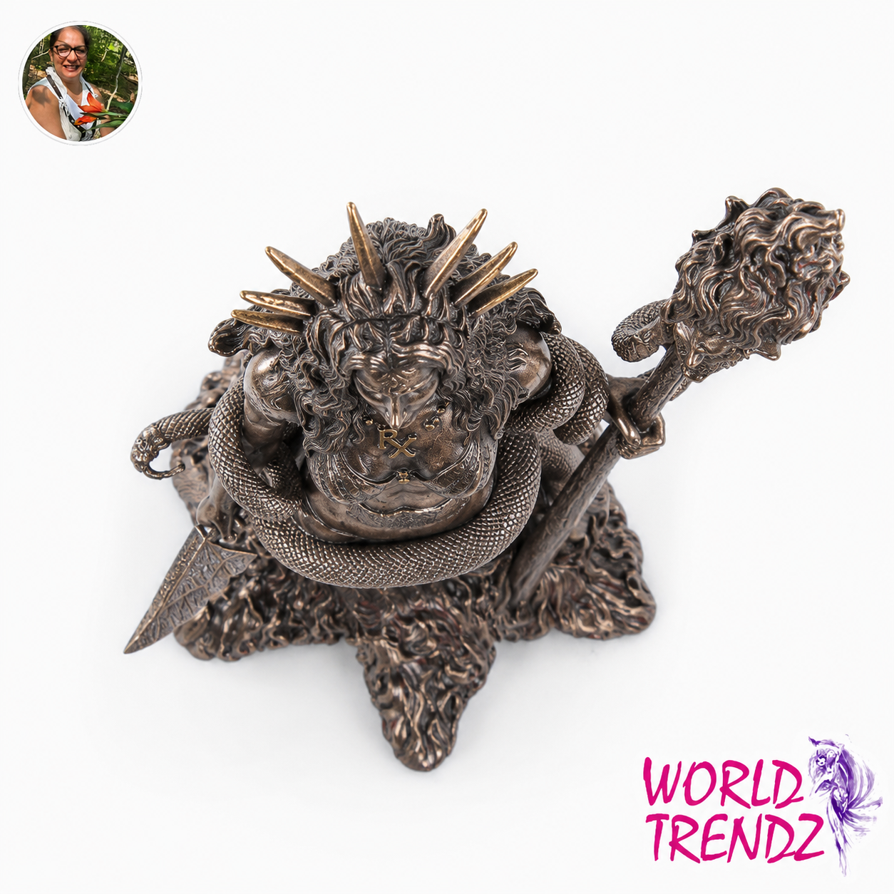 A detailed Hecate figurine wrapped in a snake, holding a mace, shown on a white background with a 'World Trend2' logo in the bottom right corner.