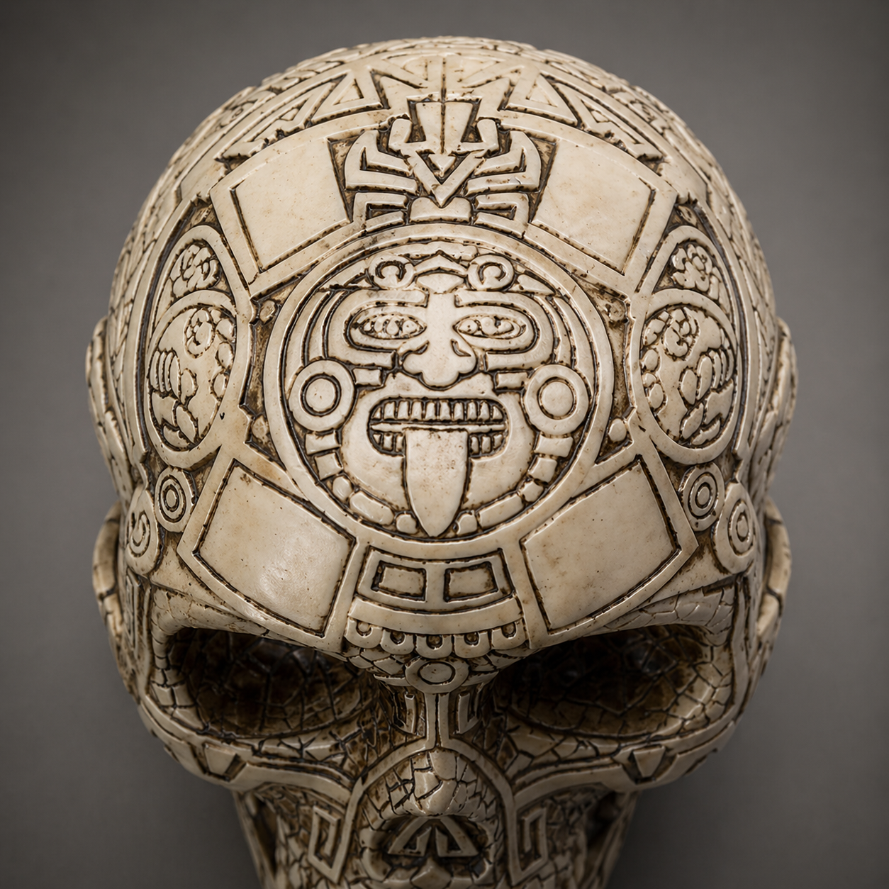 Aztec Decorative skull with intricate carvings on a gray background
