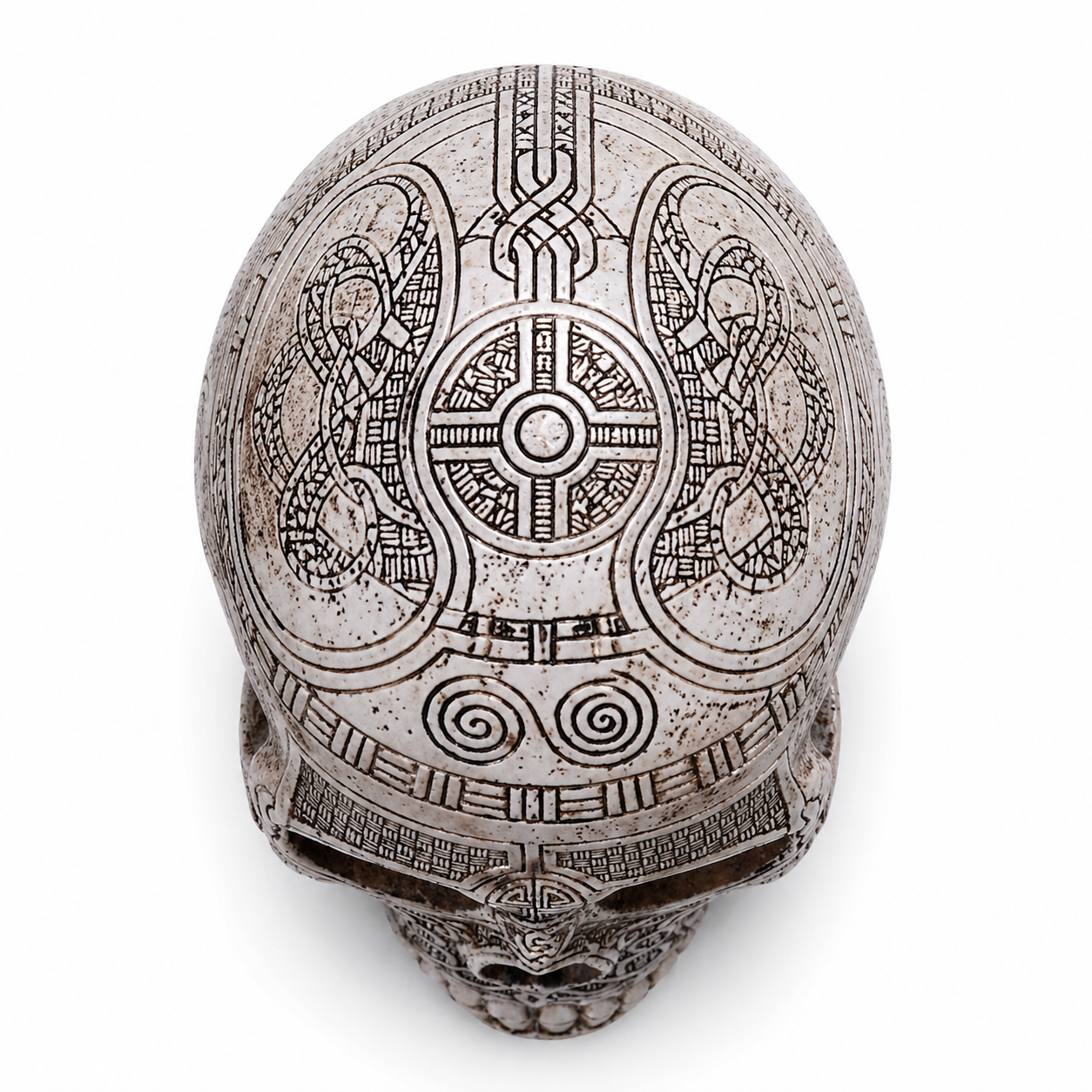 Decorative Viking skull with intricate carvings on a white background