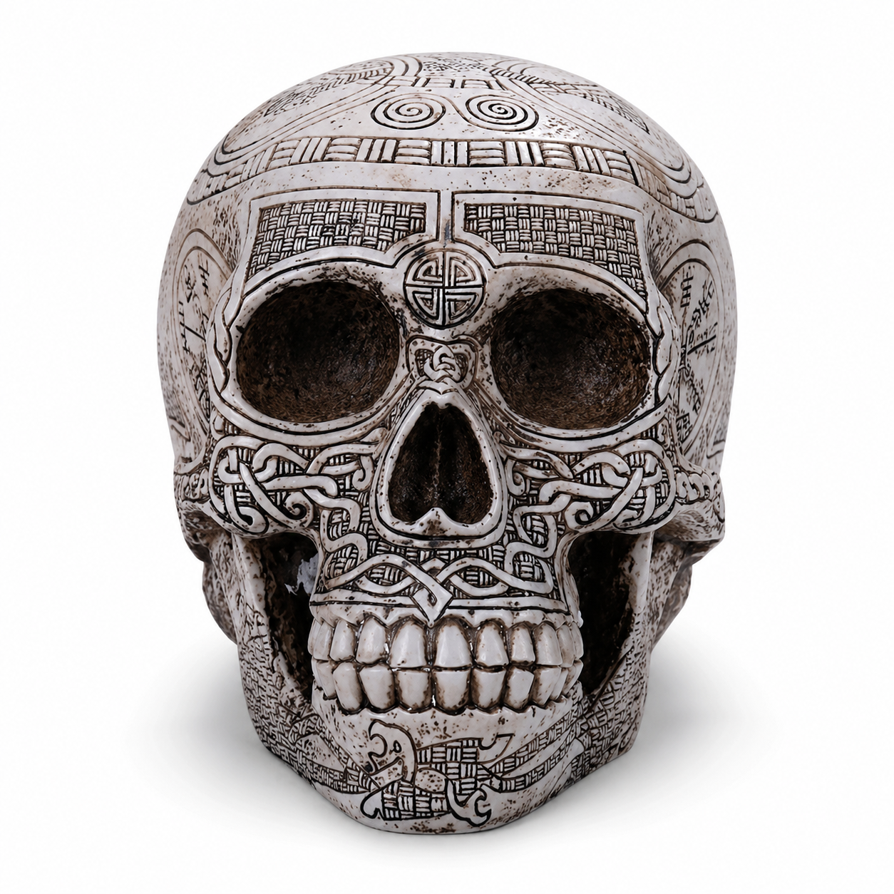 Decorative Viking skull with intricate patterns on a white background