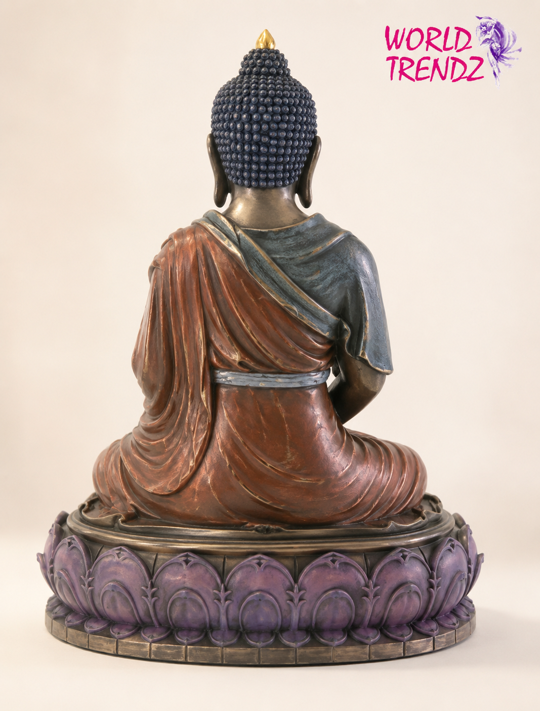 A seated Buddha Double Lotus Amitabha statue shown from the back, with a copper-brown robe, dark blue-gray shoulder drape, and a purple lotus-style base, photographed against a plain light beige background. A pink 'WORLD TRENDZ' logo appears in the top right corner.