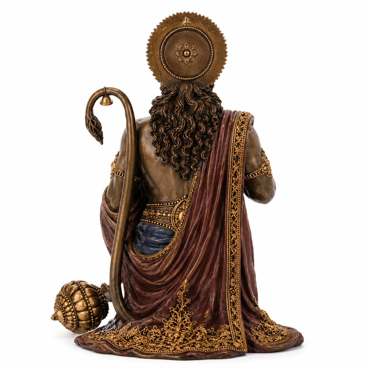 Statue of Hanuman figure in robes with a staff on a white background