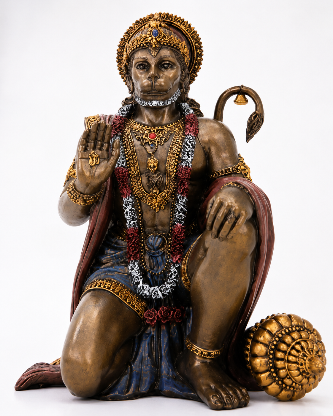 Statue of Hanuman a monkey deity with intricate jewelry and a mace, on a white background