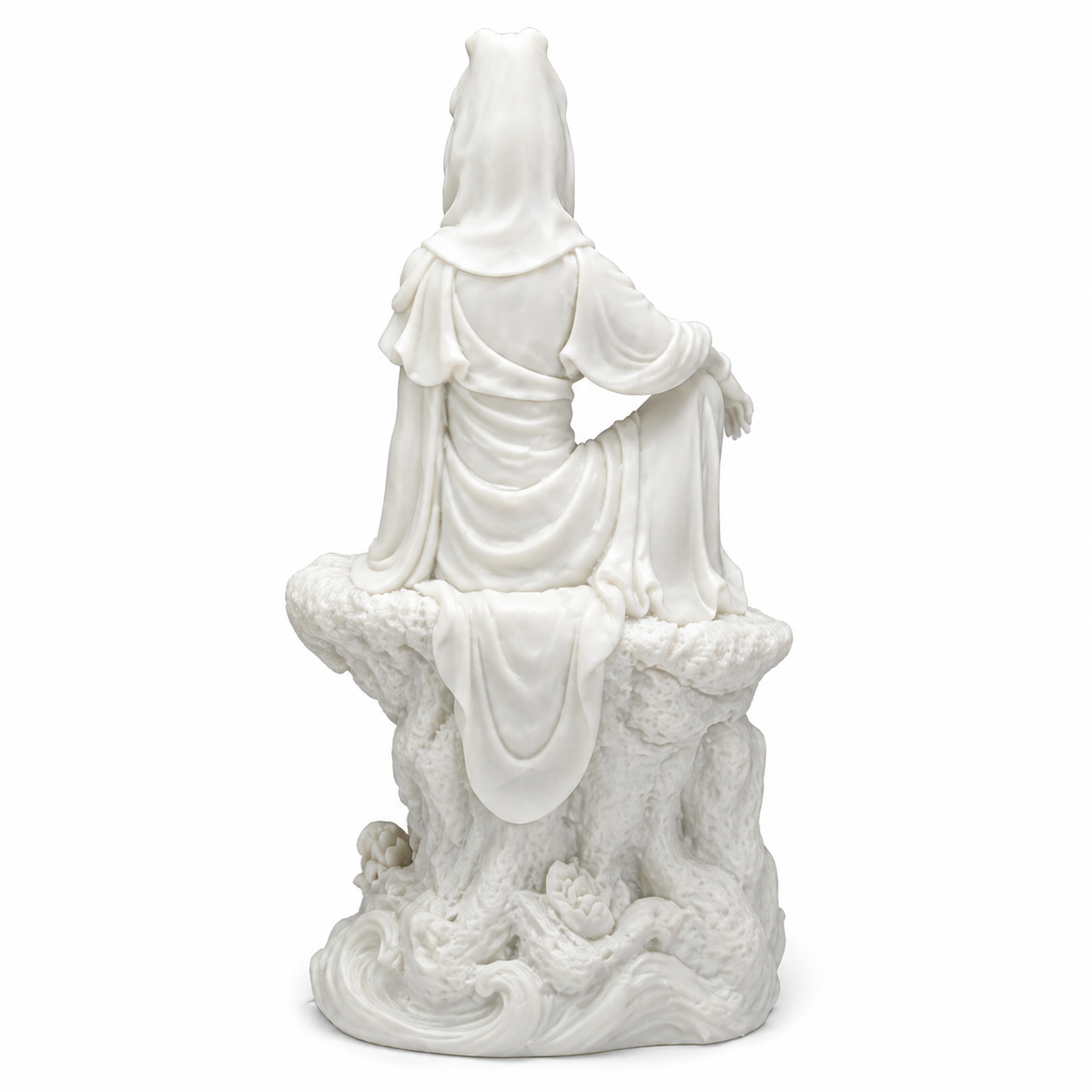 White ceramic statue of Kuan Yin on a white background