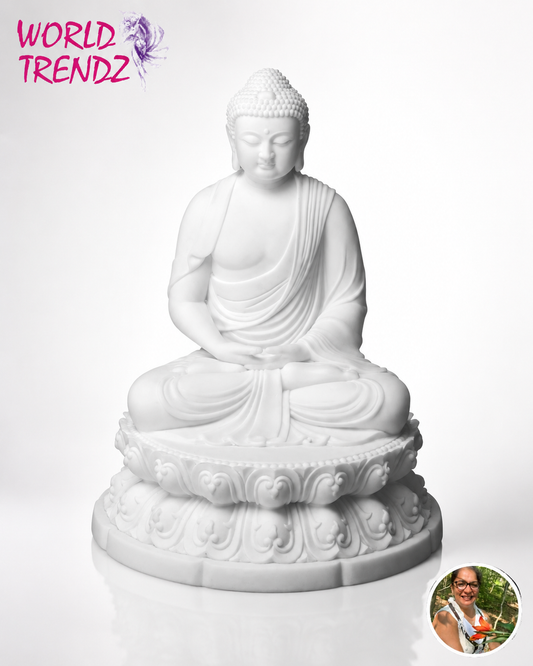 A white seated Buddha statue on an ornate lotus-style base, photographed against a clean white background. A pink 'WORLD TRENDZ' logo appears in the top-left corner, and a small circular inset photo of a person is in the bottom-right corner.