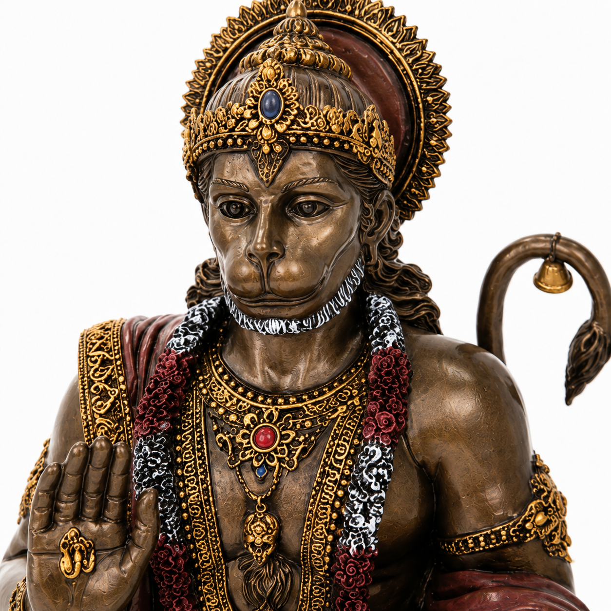 Bronze statue of Hanuman a deity with intricate jewelry and headdress on a white background