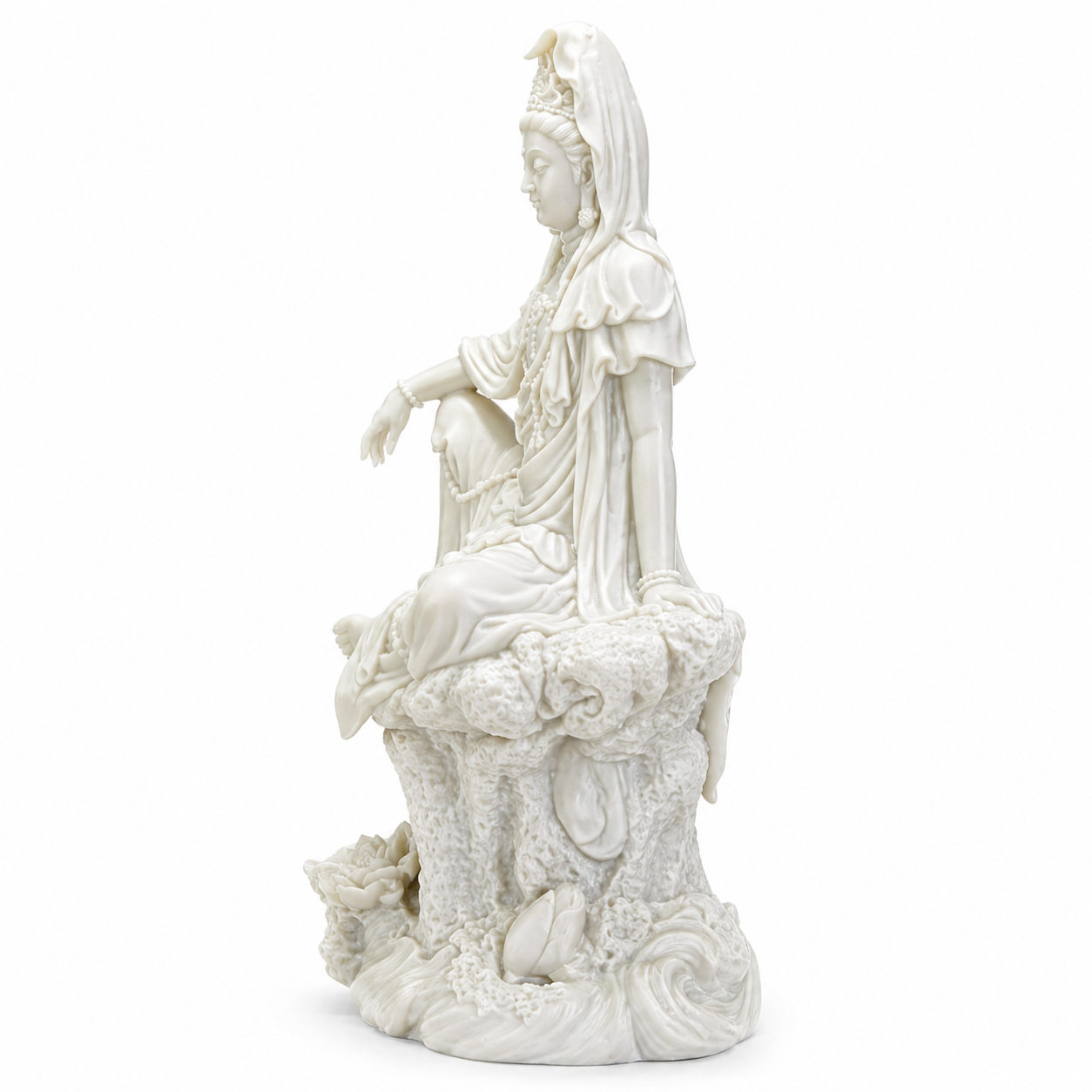 White marble statue of Kuan Yin on a white background