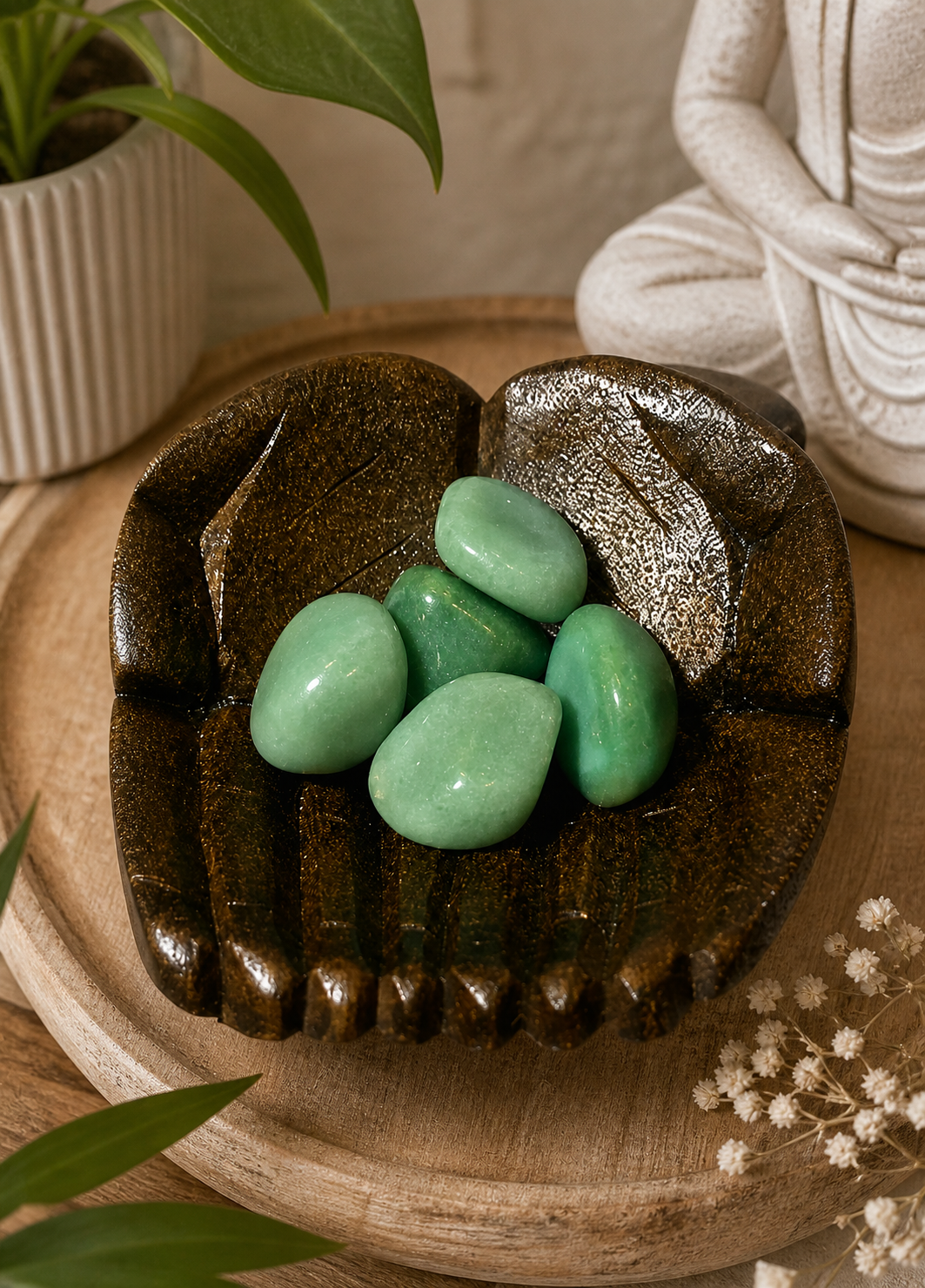 A decorative arrangement of green aventurine gemstones in a rustic wooden hand-shaped bowl, symbolizing a user incorporating natural elements into interior décor. The image conveys a sense of earthy elegance and balance, maintaining the original lighting and composition.