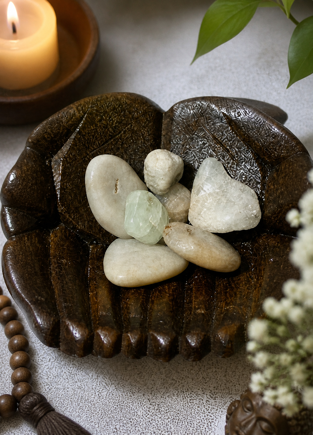 A close-up still life of natural aquamarine stones resting in a dark carved wooden dish, placed on a neutral textured surface. Soft, calming lighting enhances the serene atmosphere, suggesting use in meditation, energy healing, or chakra balancing. Emphasize tranquility, mindfulness, and spiritual focus without altering the objects.