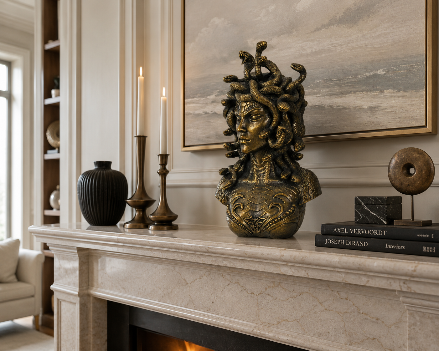 Medusa Bust on a mantelpiece with candles and books in a stylish room.