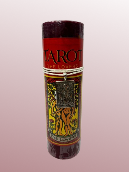 Candle with Tarot design and 'The Lovers' card illustration on a pink background