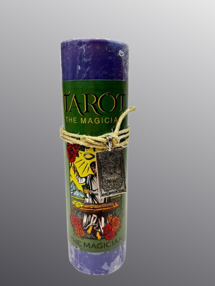 Candle with Tarot design and 'The Magician' card on a gray background