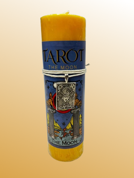 Yellow candle with Tarot design on a beige background