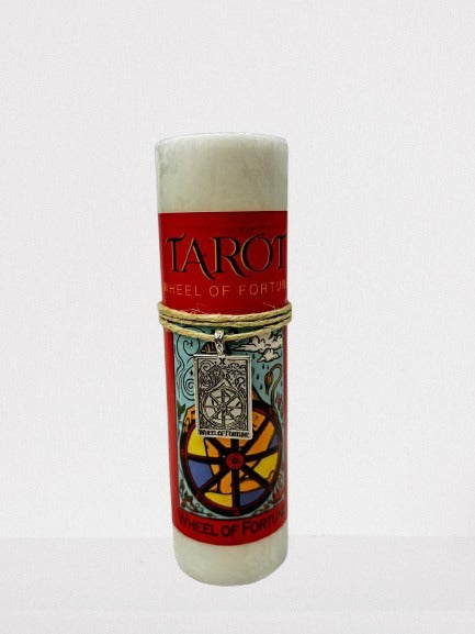 Candle with Tarot design Wheel of Fortune on a white background