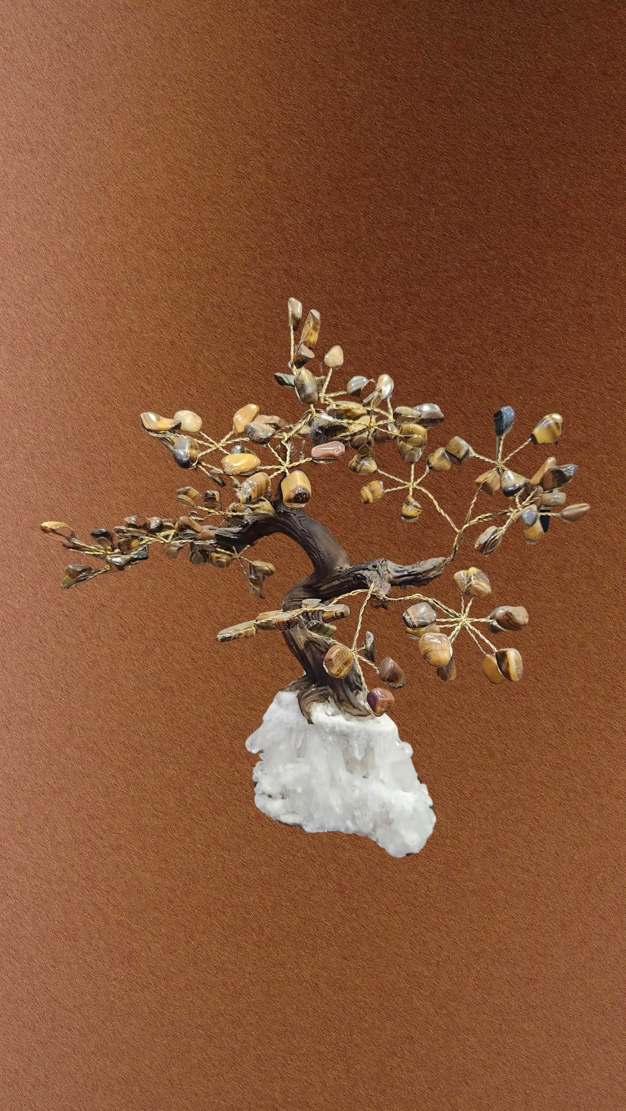 Decorative bonsai tree sculpture on a brown background