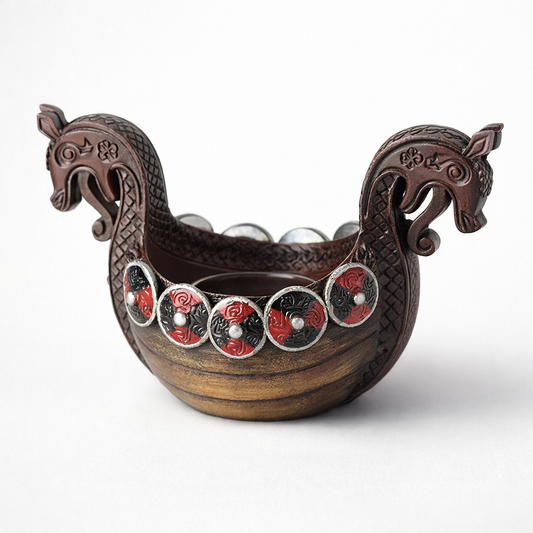 Decorative wooden boat-shaped container with horse heads on a white background