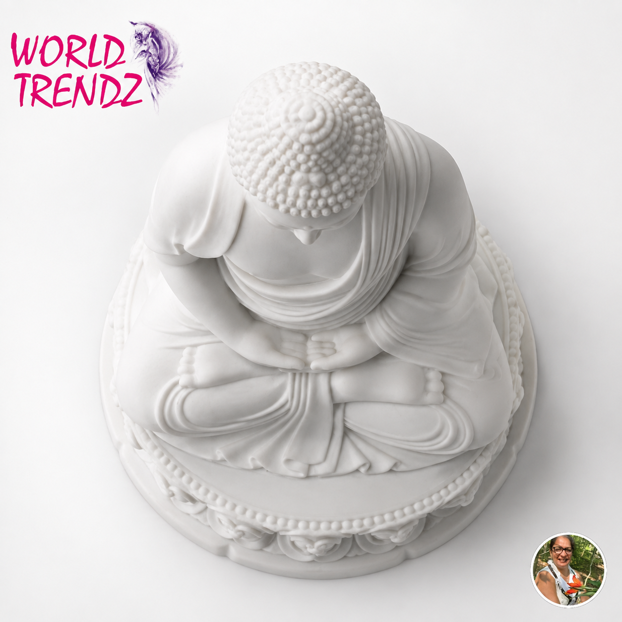 A white Buddha statue in a seated meditation pose on a circular base, photographed against a plain white background. A pink 'WORLD TRENDZ' logo appears in the top-left corner, and a small circular inset photo is in the bottom-right corner.