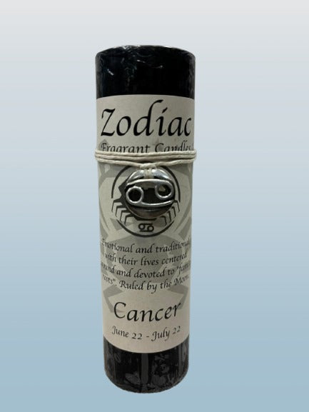 Zodiac Cancer candle in a black holder on a light blue background