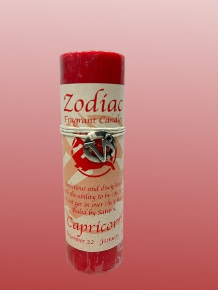 Zodiac Capricorn fragrant candle on a pink background