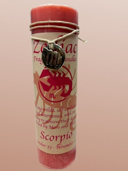 Pink candle with Scorpio zodiac design on a pink background